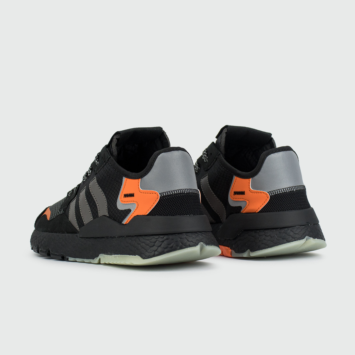 Adidas nite hot sale jogger black orange